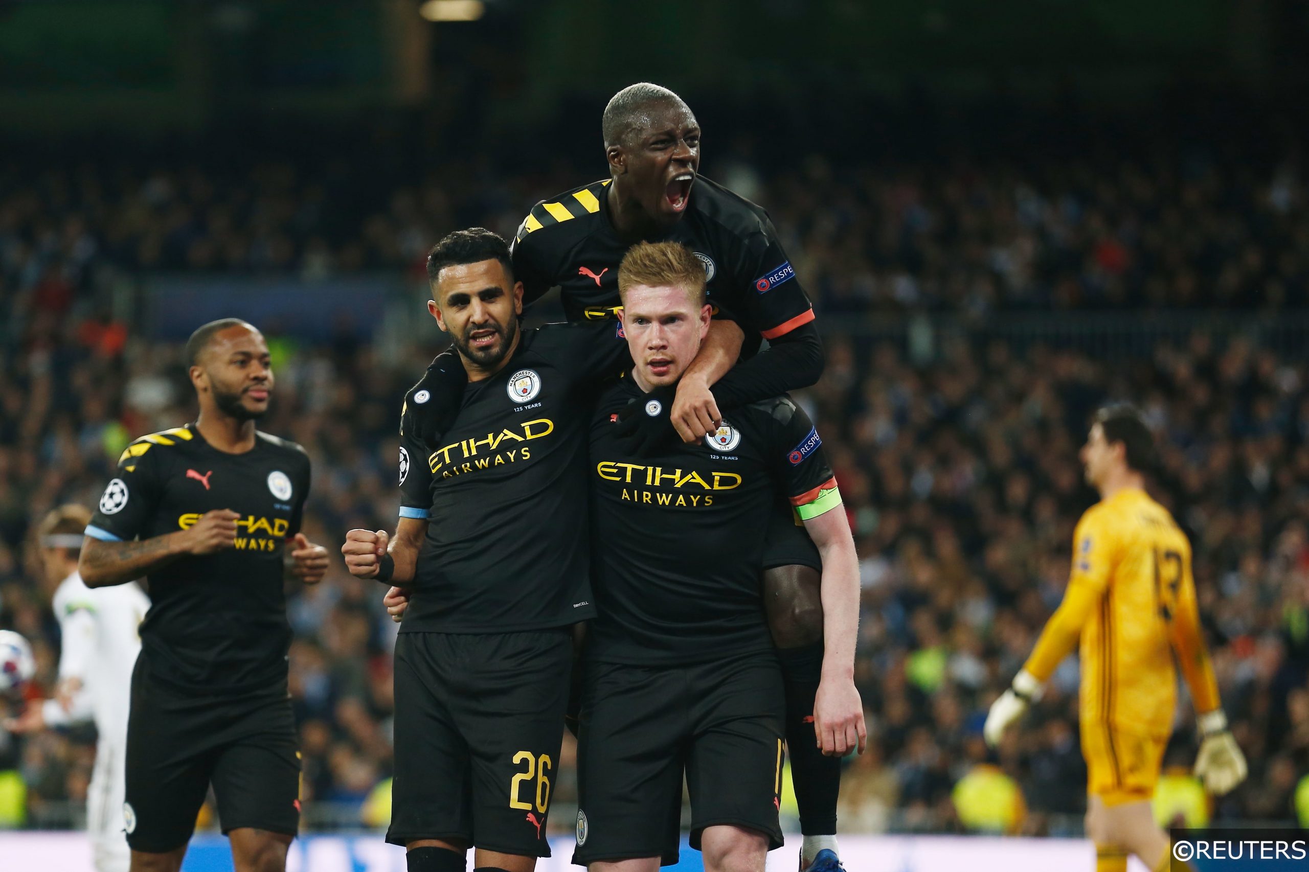 Manchester City players celebrate a goal in the Champions League